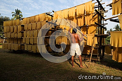 Worker in local rubber business Editorial Stock Photo