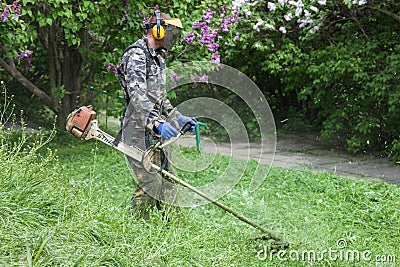 Worker in M.M. Gryshko National Botanical Garden (Kiev, Ukraine). Editorial Stock Photo