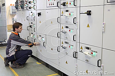 Worker make Maintenance of Electrical Equipment. Editorial Stock Photo