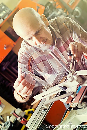 Worker making nameboard Stock Photo