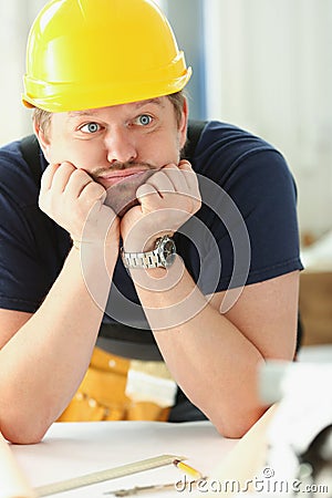 Worker man wearing architect hardhat thinking, looking bored and tired at construction site Stock Photo