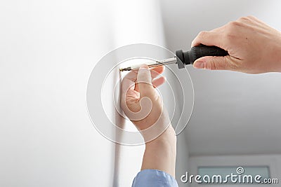 Worker manually tightening hang Stock Photo