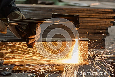 Worker metal Cutting With acetylene welding cutting torch Stock Photo