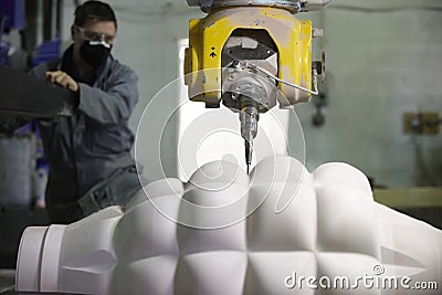 Worker and multi axis machine Stock Photo