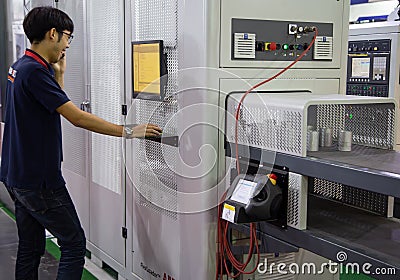 Worker operate Flexible Loader Machine Editorial Stock Photo