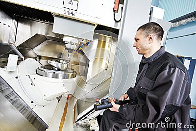 Worker operating metal machining center Stock Photo