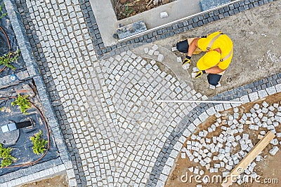 Worker Paving Garden Path Aerial Vista Stock Photo