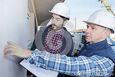 Worker at plastering facade work Stock Photo