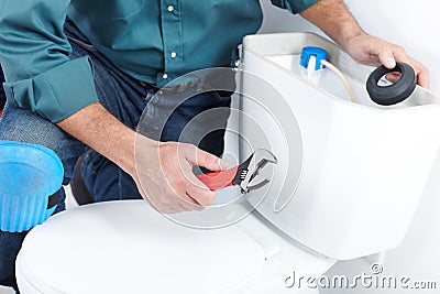 The worker with a plunger Stock Photo