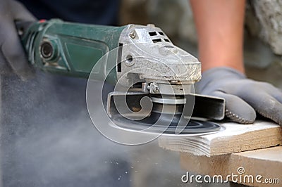 Worker polishing a wood table Stock Photo