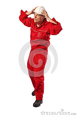 Worker in red uniform wearing white hardhat Stock Photo