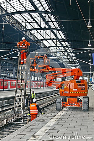 Worker repair the catenary in the station Editorial Stock Photo