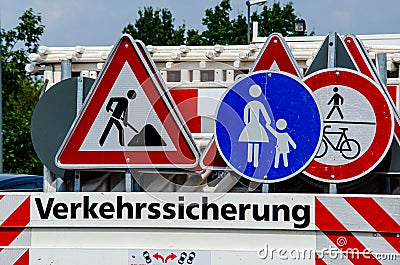 A worker`s truck with roadsigns at a road construction site Stock Photo