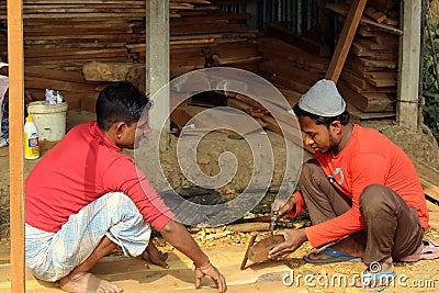 Worker Sawing Wood At Construction Site Editorial Stock Photo