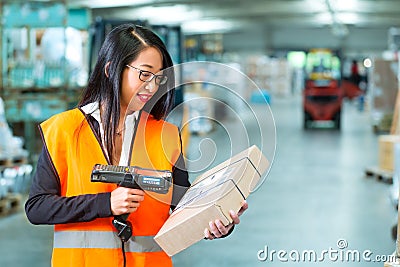Worker scans package in warehouse of forwarding Stock Photo