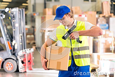 Worker scans package in warehouse of forwarding Stock Photo