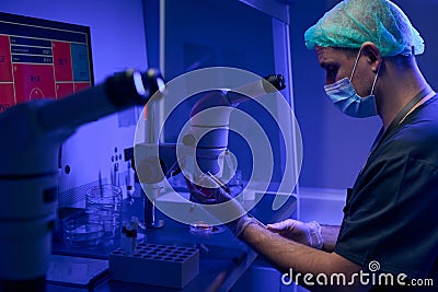 Worker of scientist laboratory preparing sample to examine Stock Photo