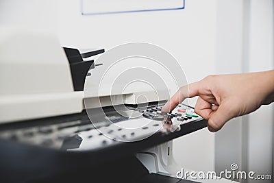 Multi-function device in office center, worker sets the scan options for send digital copy of documents to email Stock Photo