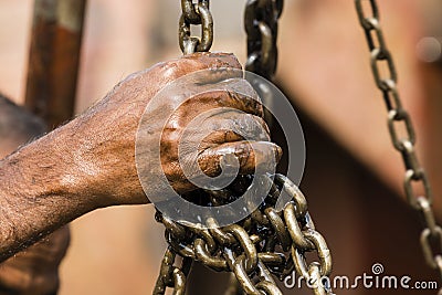 Worker at a shipyard in Dhaka Bangladesh holds a chain with his hands Stock Photo