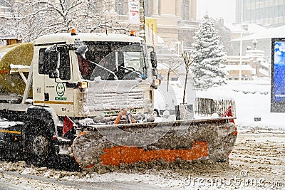 Worker Snow Plow Truck During Heavy Snow Storm In Downtown Bucharest City Editorial Stock Photo