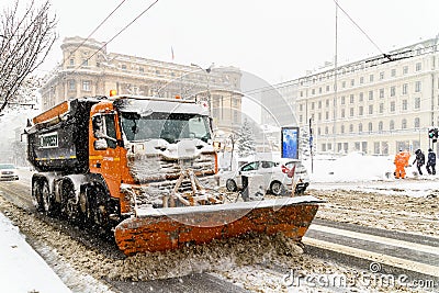 Worker Snow Plow Truck During Heavy Snow Storm In Downtown Bucharest City Editorial Stock Photo