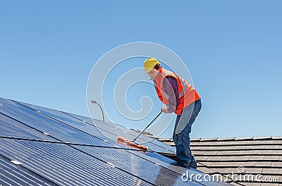 Worker and solar panels Stock Photo