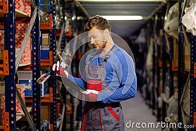 Worker in a spare parts warehouse Stock Photo