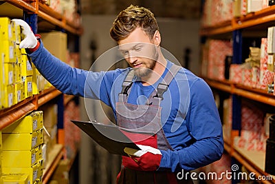 Worker in a spare parts warehouse Stock Photo