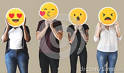 Worker standing and holding face emojis Stock Photo