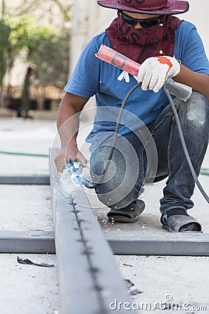 Worker steel welding with unsafety position Editorial Stock Photo