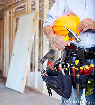 Worker with a tool belt. Stock Photo