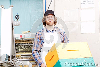 Worker transporting beehives Stock Photo