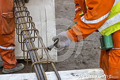 Worker tying rebar Stock Photo