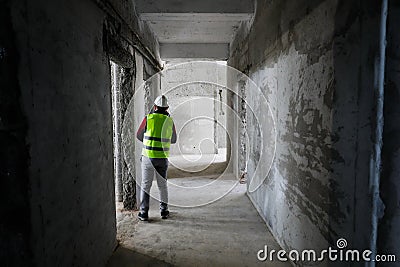 Worker in an unfinished building on a hospital construction site Stock Photo