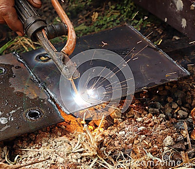 Worker use electric welding Stock Photo