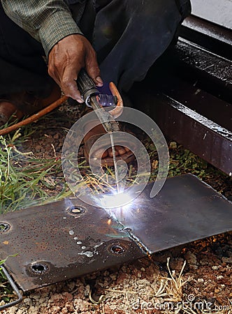 Worker use electric welding Stock Photo