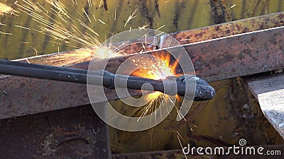 A Worker Uses a Oxygen Acetylene Cutting Torch To Cut Scrap Stock Video