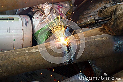 A worker uses a oxygen acetylene cutting Stock Photo