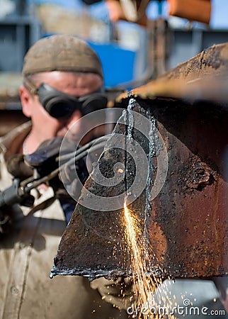 Worker using a propane torch Stock Photo