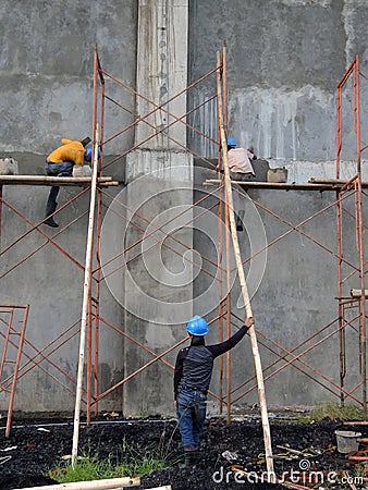Worker using a safety protection of workers building a coal field project Editorial Stock Photo