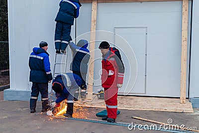 Worker weld metal and sparks Editorial Stock Photo