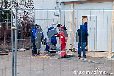 Worker weld metal and sparks Editorial Stock Photo