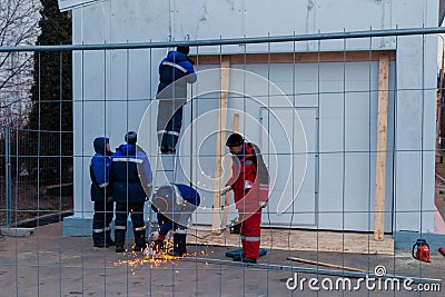 Worker weld metal and sparks Editorial Stock Photo