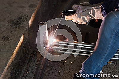 The worker weld pipe steel Stock Photo