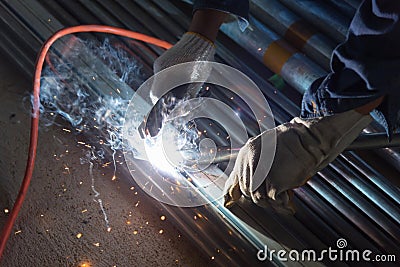 The worker weld pipe steel Stock Photo