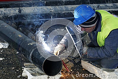 Worker welding Editorial Stock Photo