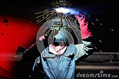 Shipyard worker welding ship repair under water ballast tank Stock Photo