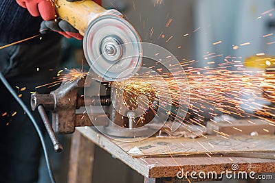 Worker working with a circular grinder Stock Photo