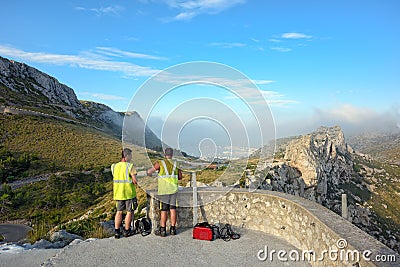 Workers build the observation platform Mirador Colomer on the rocks. Island Majorca, Spain. Editorial Stock Photo