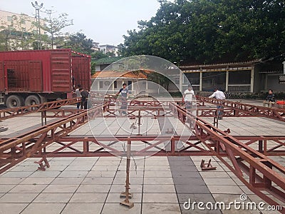 Workers are building a stage frame for the third temple fair on the third day of the third lunar month. In shenzhen xixiang, China Editorial Stock Photo